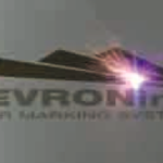 A laser at work marking a logo on metal