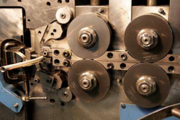 Extension spring being wound on a CNC spring maker at Spring Manufacturing Corp. (Photo by Jean Butler.)