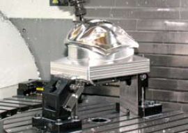 The Kurt 5-axis clamping system allowsfor the larger head clearance required on large5-axis machines.Photo courtesy of Kurt Manufacturing Company. The Kurt 5-axis clamping system allowsfor the larger head clearance required on large5-axis machines.Photo courtesy of Kurt Manufacturing Company.