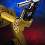 Grip-Gage-Go solution from  Control Gaging Inc., two standard gages are attached to  a robot gripper. They measure the part diameter in two  places as the part is being handled. This takes the place of  a separate gage station and saves the time that would be  required to load/unload the part from a gage station.